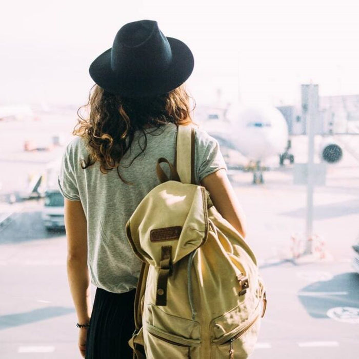 Girl with backpack travelling