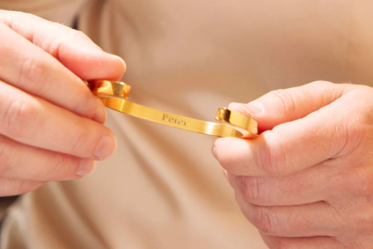 gold memorial pendant with the name Peter