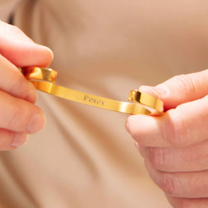 gold memorial pendant with the name Peter