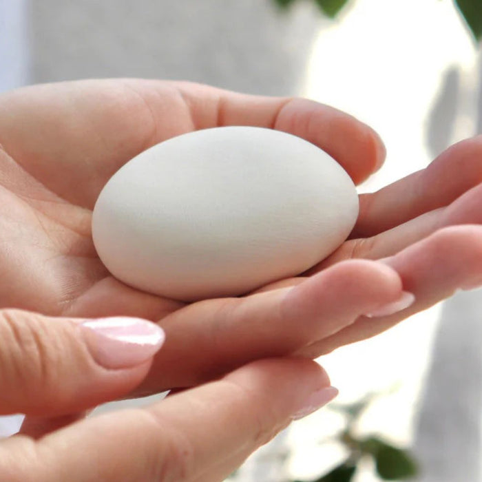 woman holding cremation stone