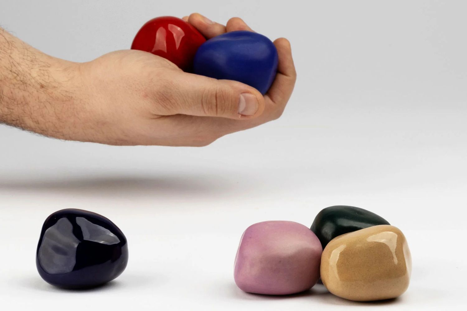 person holding cuddle stones
