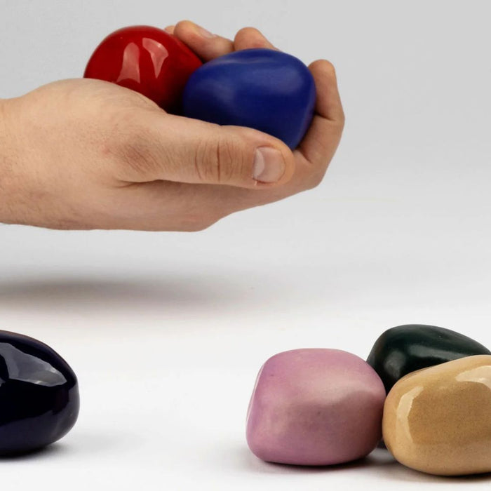 person holding cuddle stones
