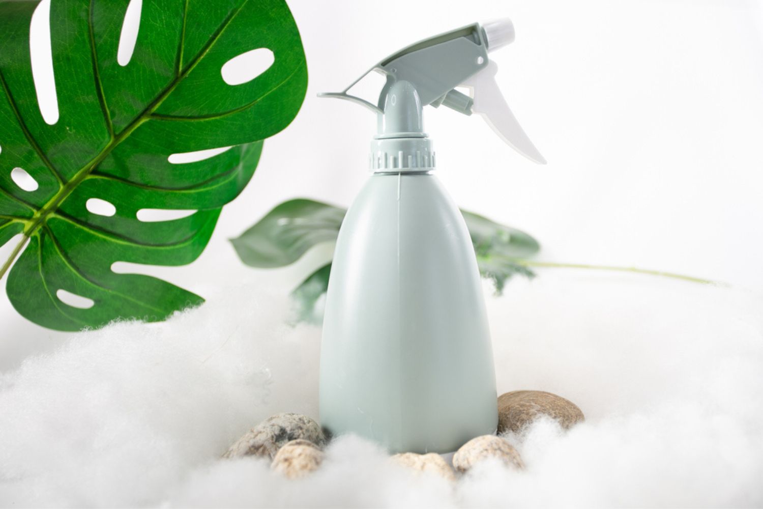 spray bottle cleaner surrounded by stones